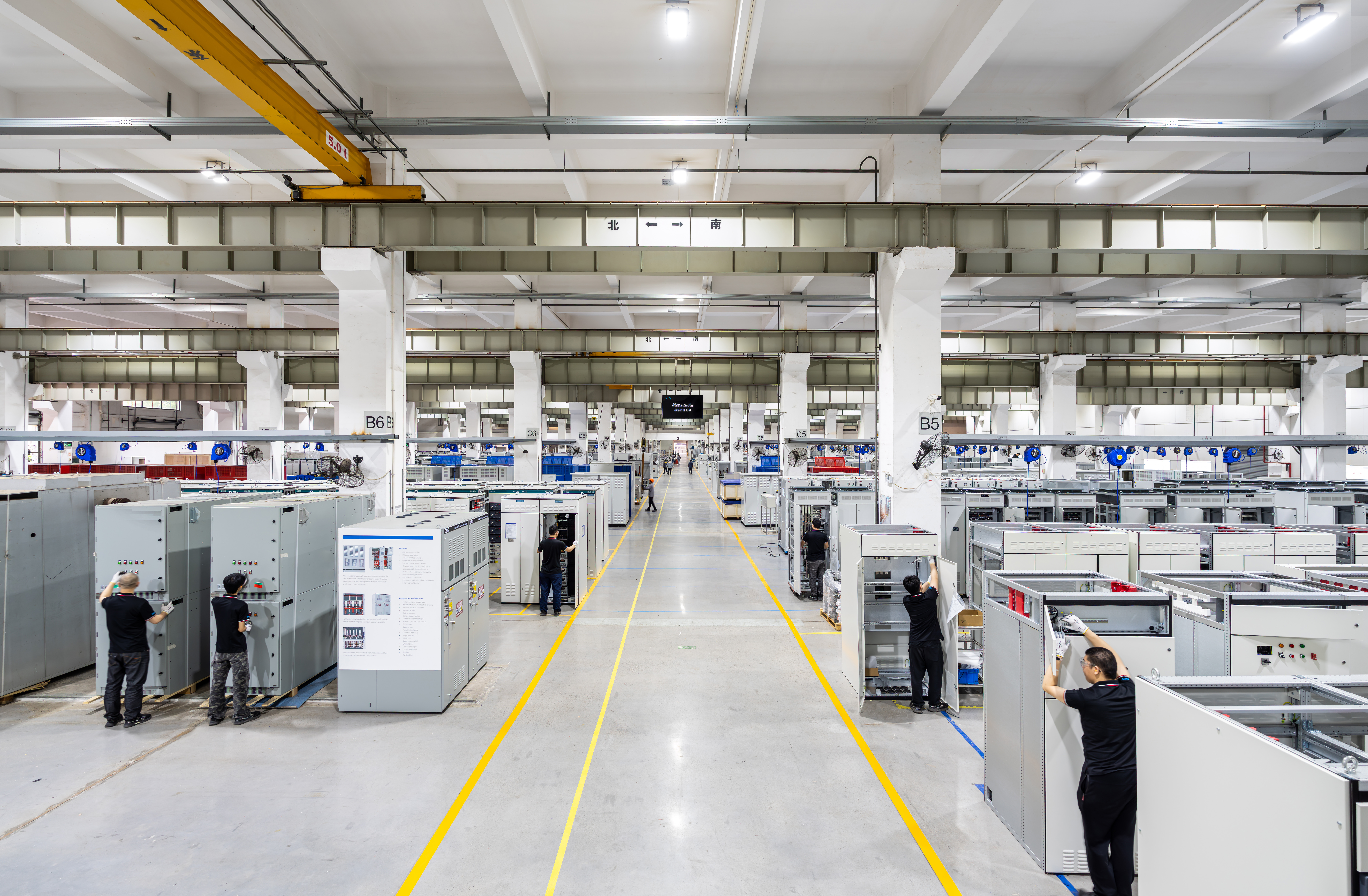 GEIS manufacturing floor with workers and assembled equipment